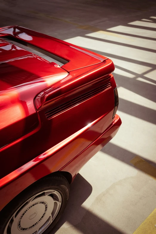 a red sports car parked on the side of a road