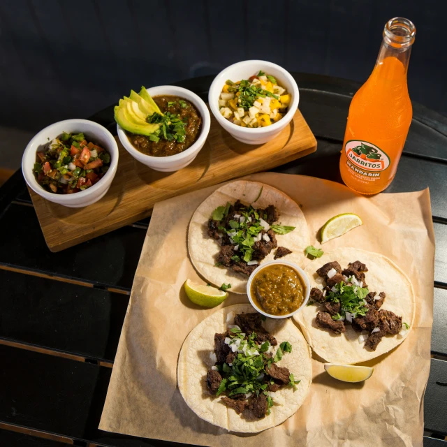 three tacos on top of a paper towel