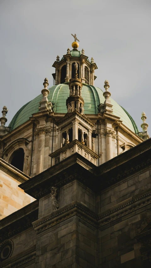 a view from below of a building with two spires