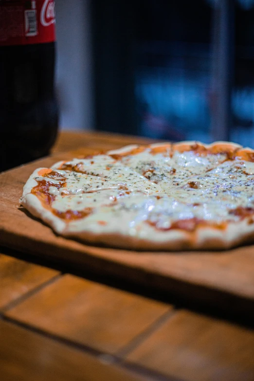 a pizza that is sitting on a wooden table