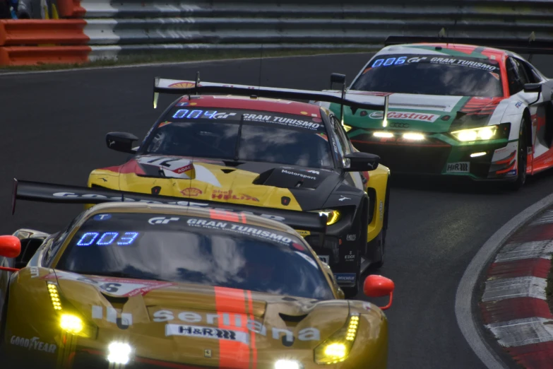 the porsches racing on the track for a race