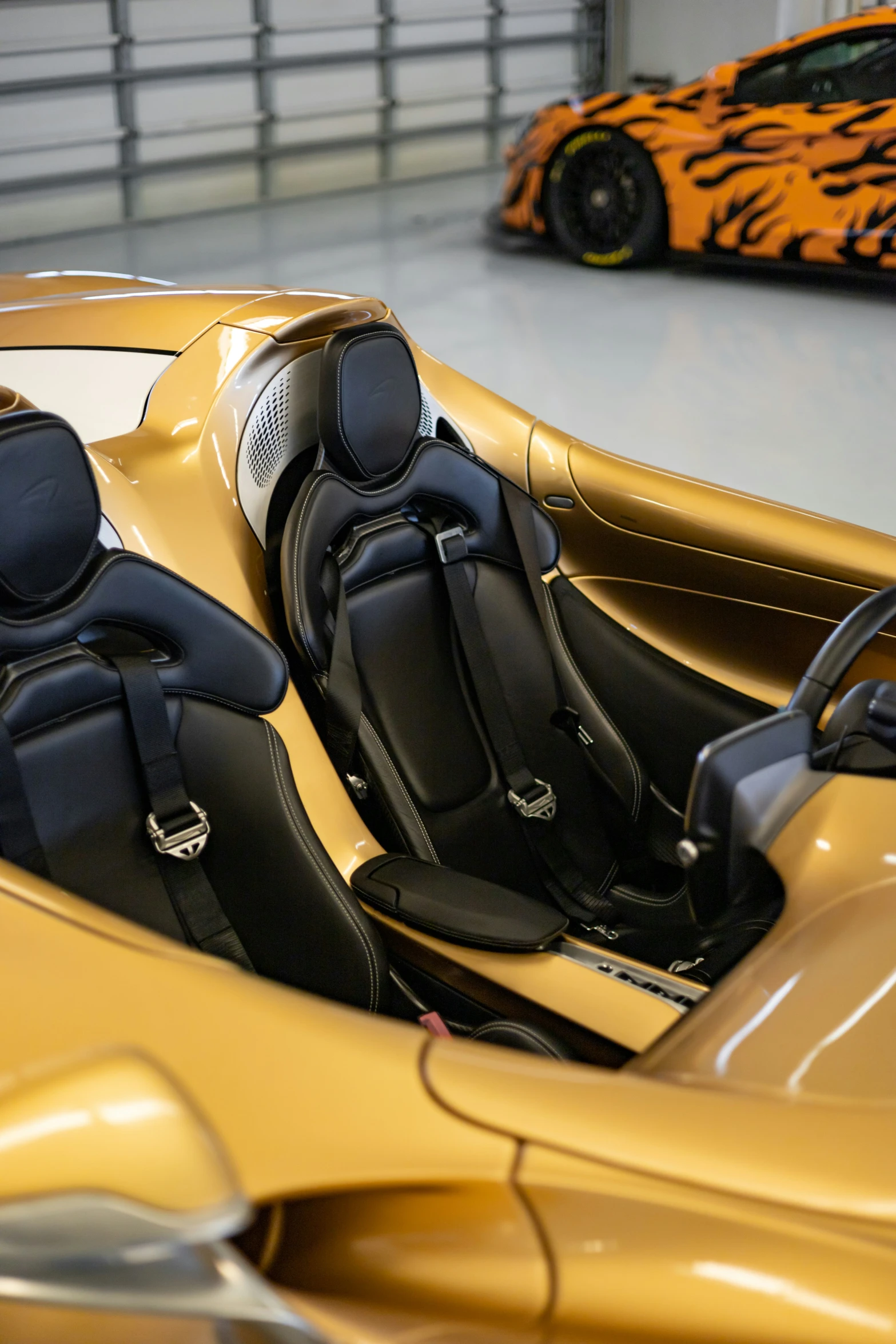 a large sports car is shown parked in the garage