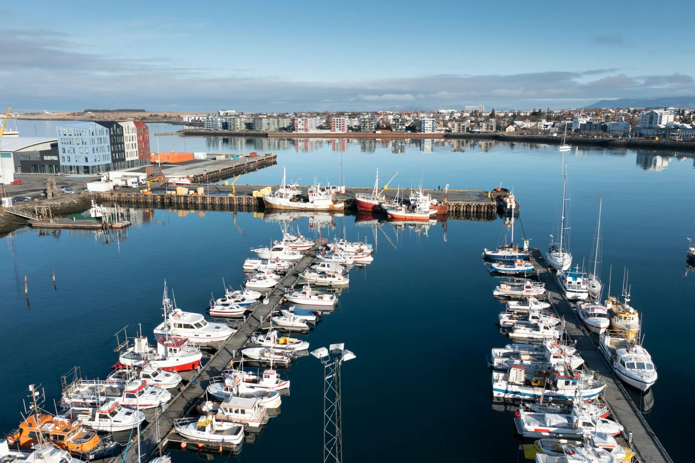 many boats are tied up to a dock