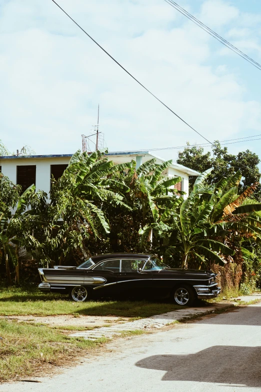 a very nice looking black truck in front of some trees