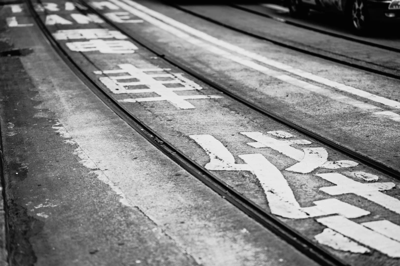 a black and white po of trains on the tracks