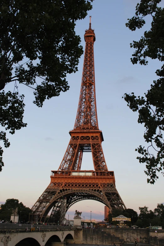 a very tall and ornate tower in the middle of a park