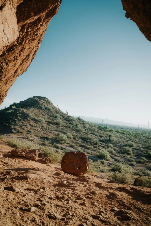 an image of a view from behind some rocks