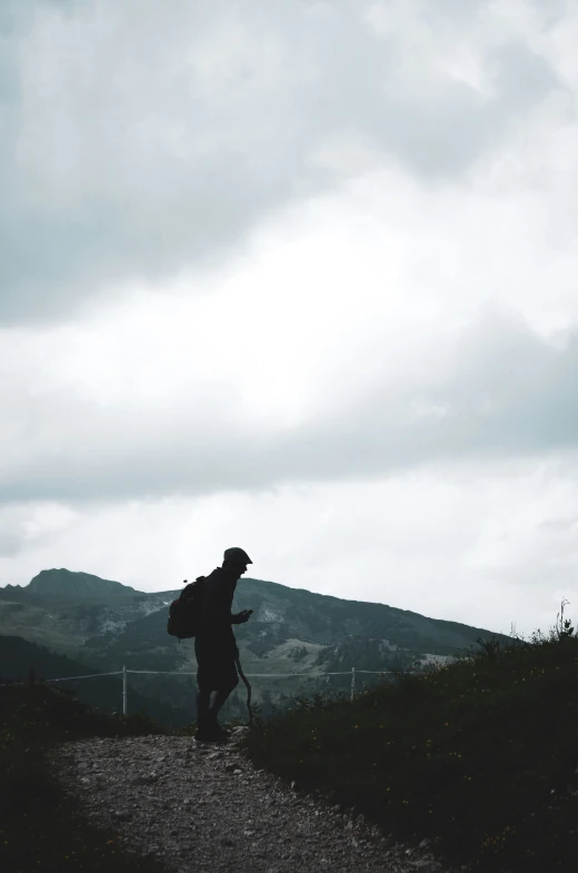 a person with a backpack on a path