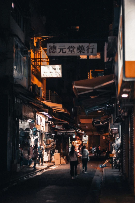 people are walking around the busy asian streets