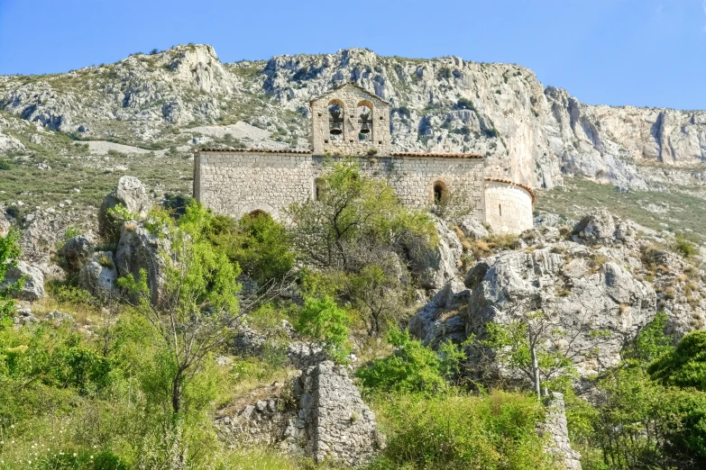 there is a building on the side of a mountain