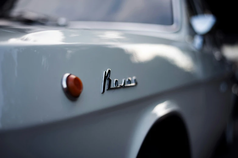 an old car with a rusted tail light