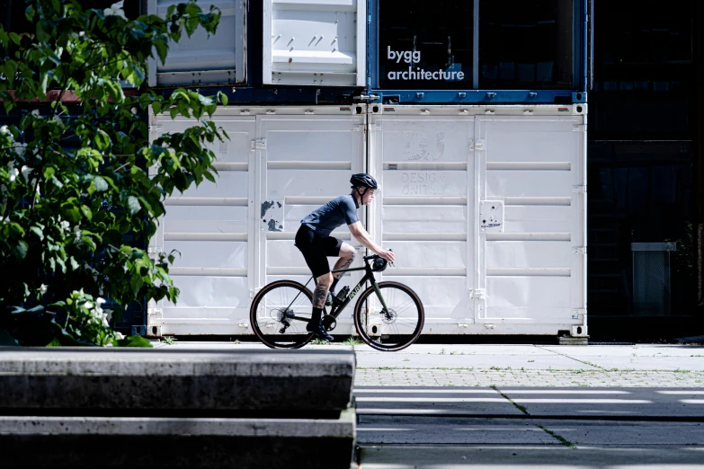 a man riding a bike on top of cement steps