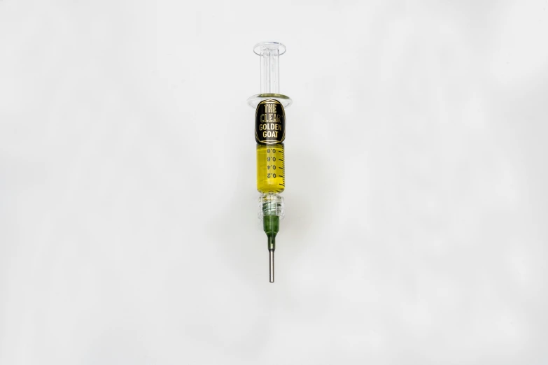 the needle on top of a medical syrl