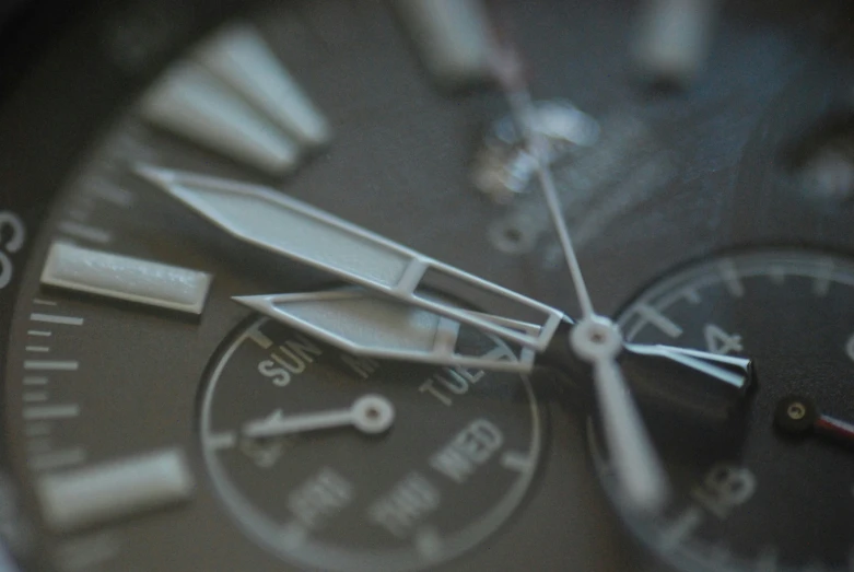 the silver and black dials of a watch face