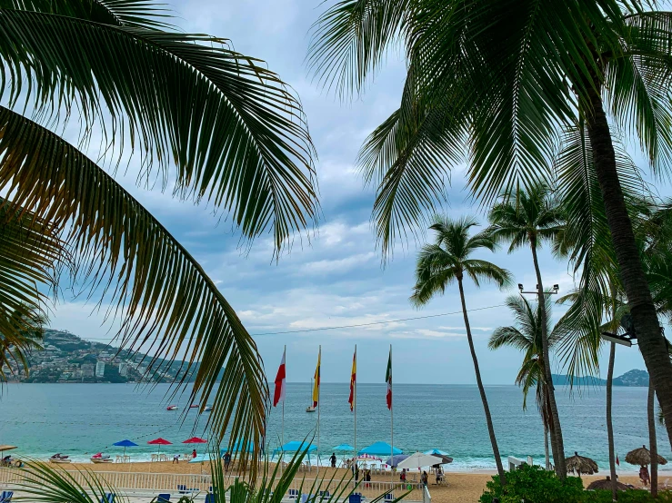 the beach is filled with people who are lounging