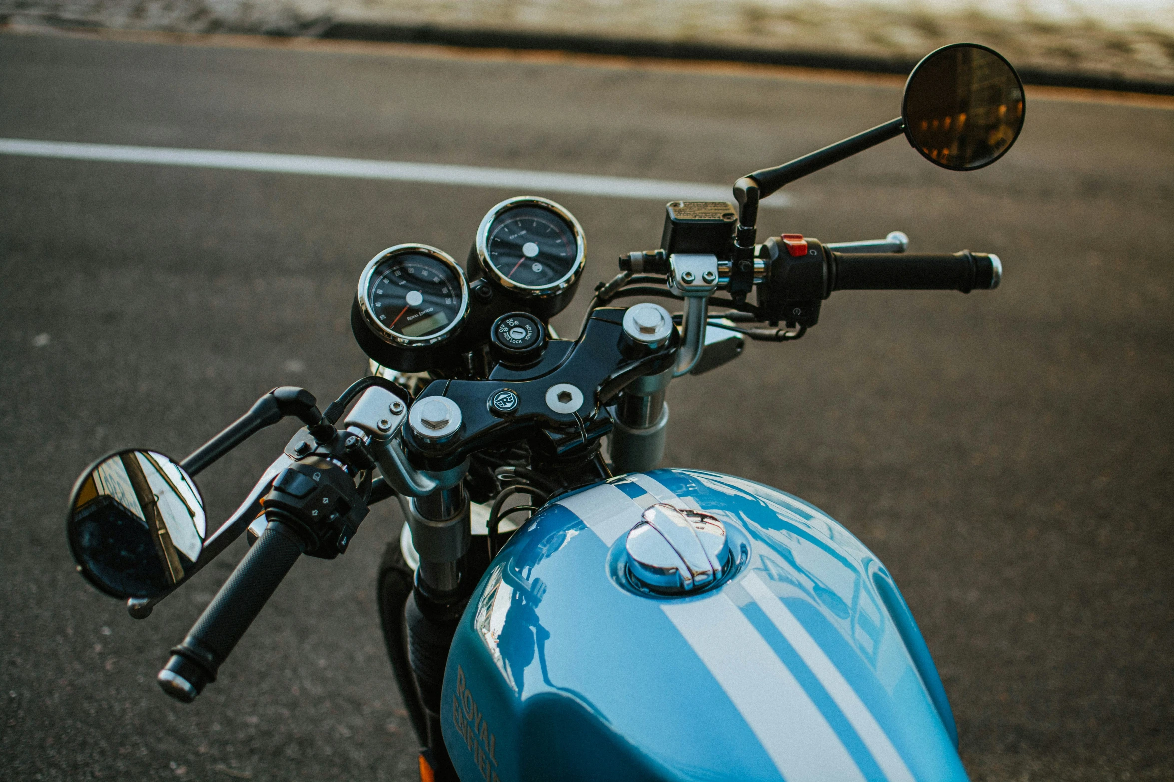 a motorcycle is shown with two gauges on the handlebar