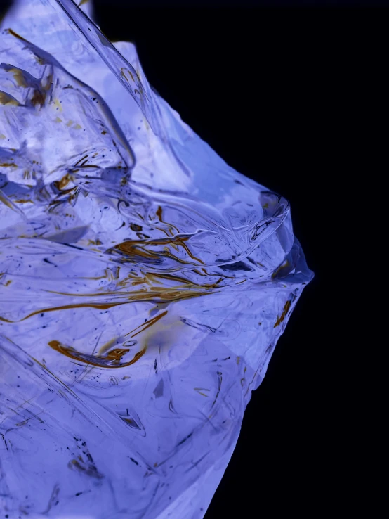 a clear ice on the bottom of an ice block