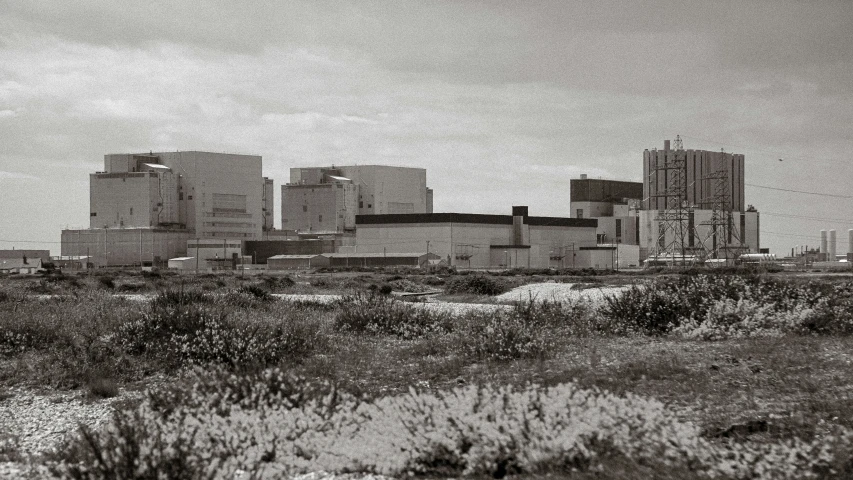 a city skyline on an overcast day with tall buildings