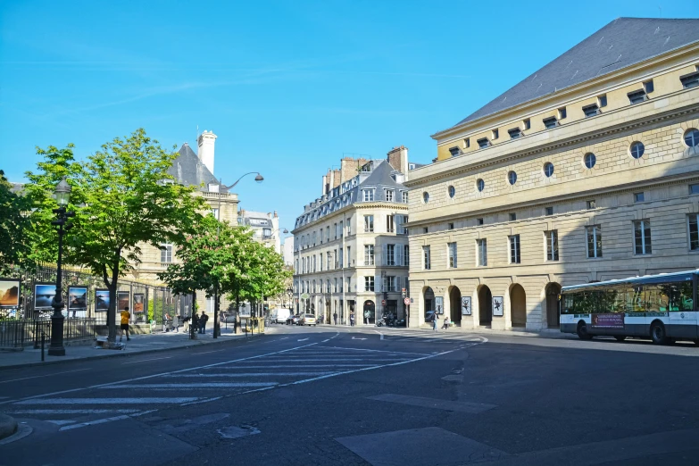 a big empty street with buildings next to it