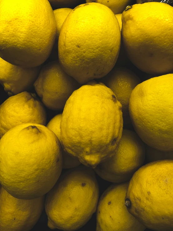 bunch of lemons on display in a shop