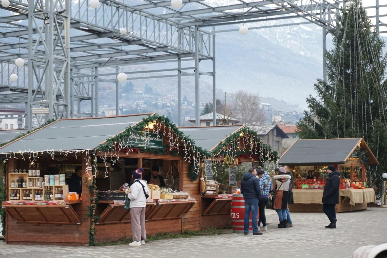 a market with people looking at goods on display