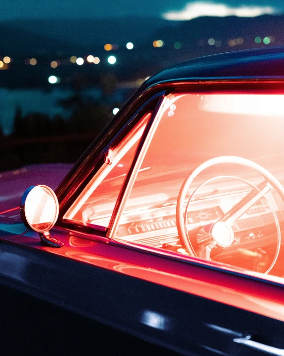 a dark car with the interior showing the inside of it