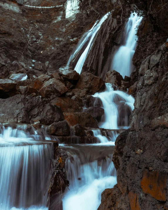 there are several water falls and rocks in the water