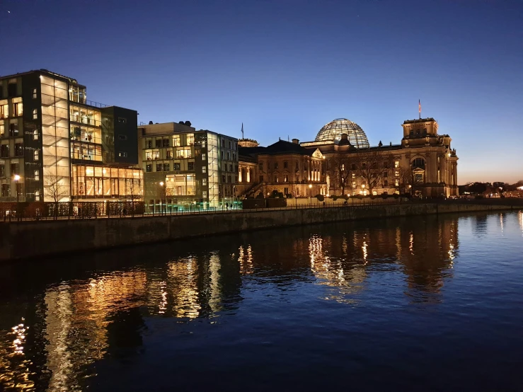 a city by a body of water at night