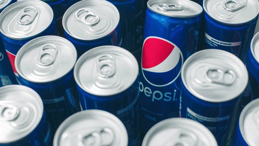 pepsi can displayed in rows in a room