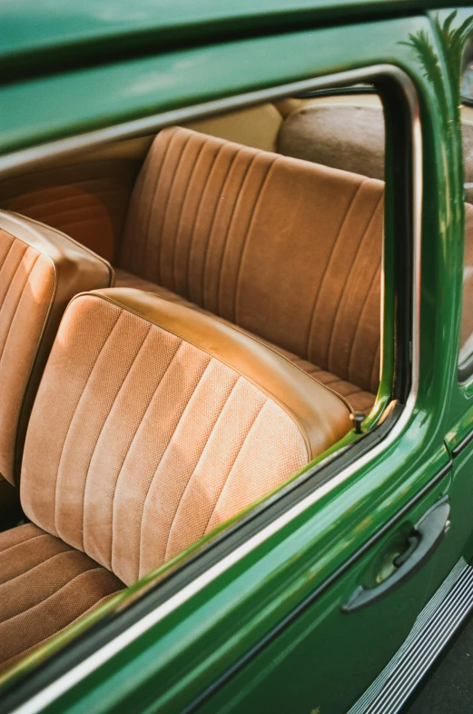 an open car door with tan seats in it