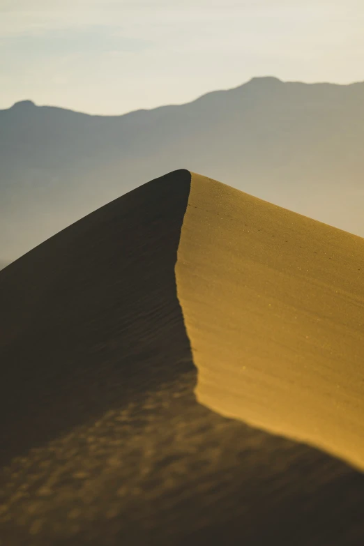 a desert like landscape with hills in the background