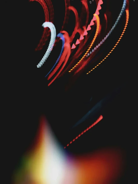 a blurry s of some lit neon lights