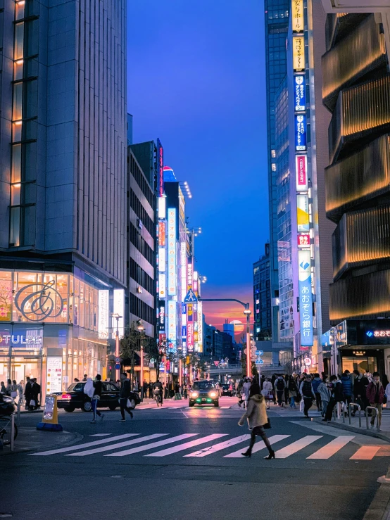 there are people walking on the street during this time of day