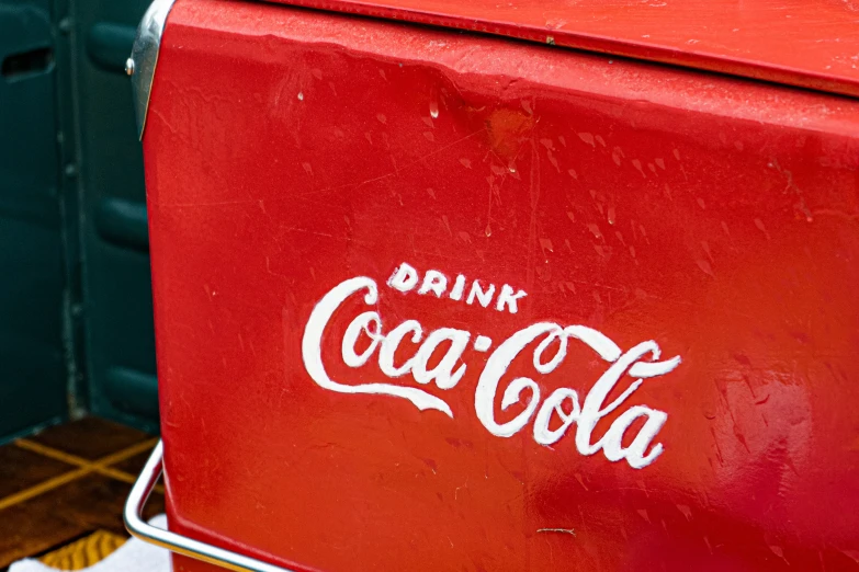 an image of a red coke cooler for coke