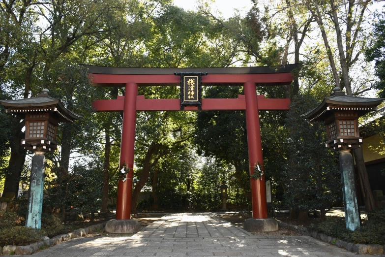 two red pillars with wooden doors at the entrance