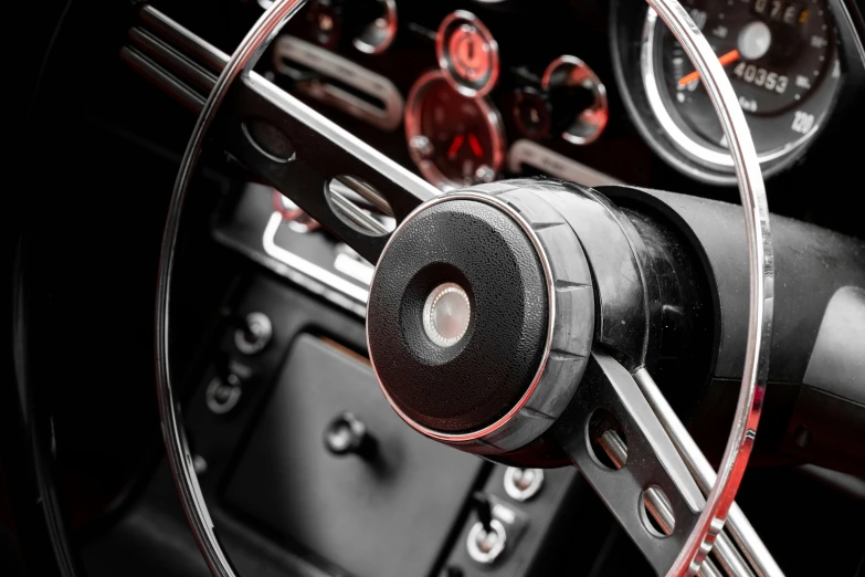 view of inside the driver wheel, dashboard and steering 