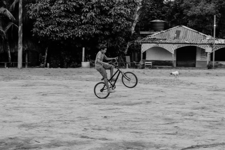 a man is riding a bike in the middle of a field