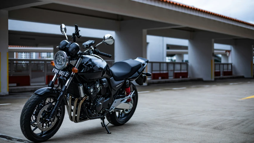 a motorcycle parked in front of an empty parking lot