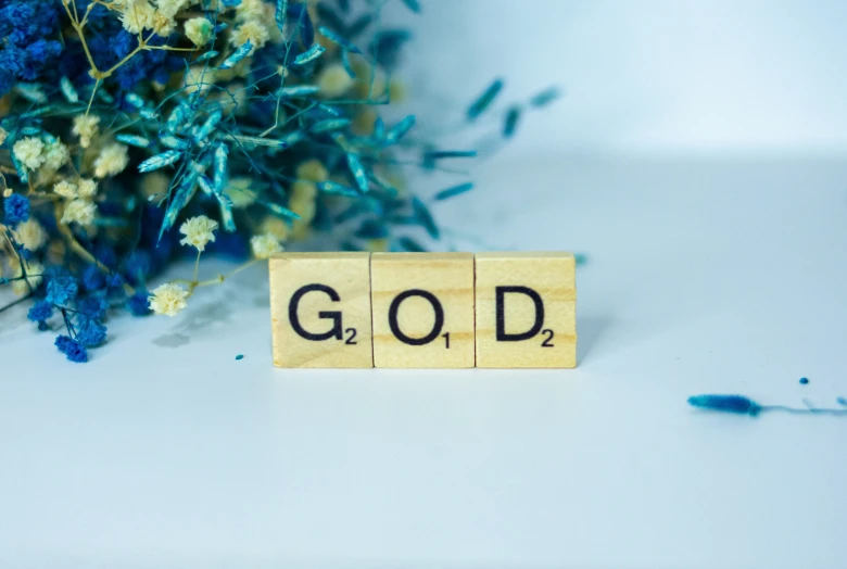 some small wooden blocks with the word god spelled in them