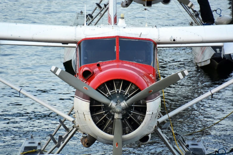 an airplane propeller attached to some boats in the water