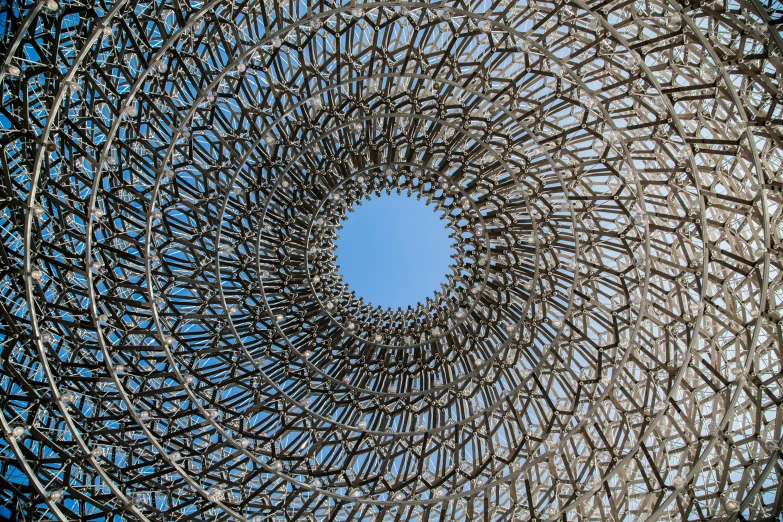 a large sculpture with circles and holes around it