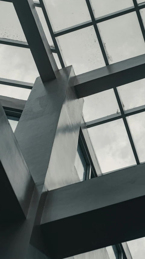 abstract metal structures against a cloudy blue sky