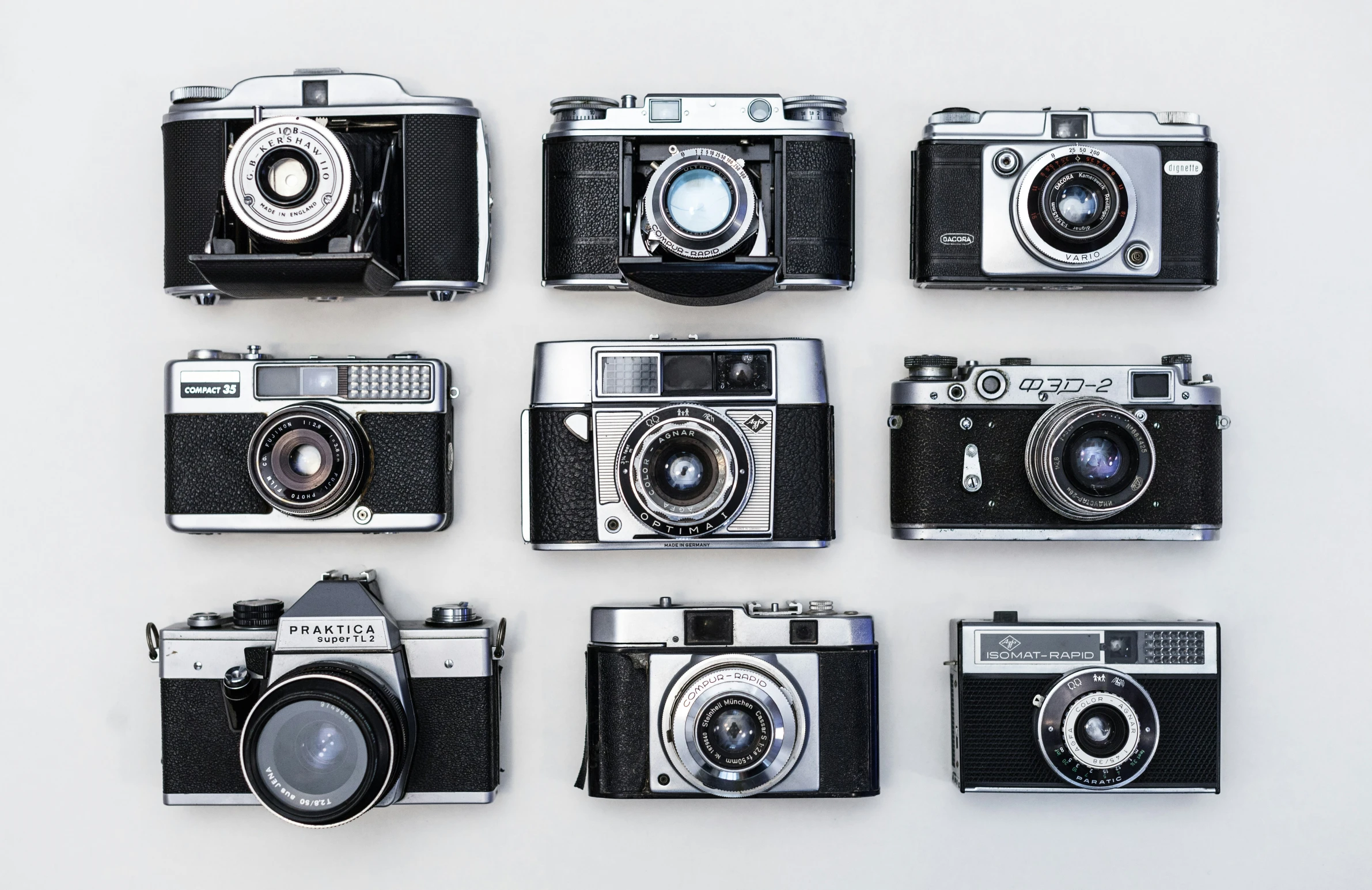 a series of six cameras laying side by side