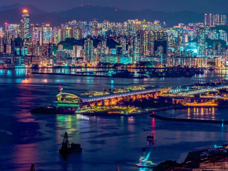 a night time view of city lights over a body of water