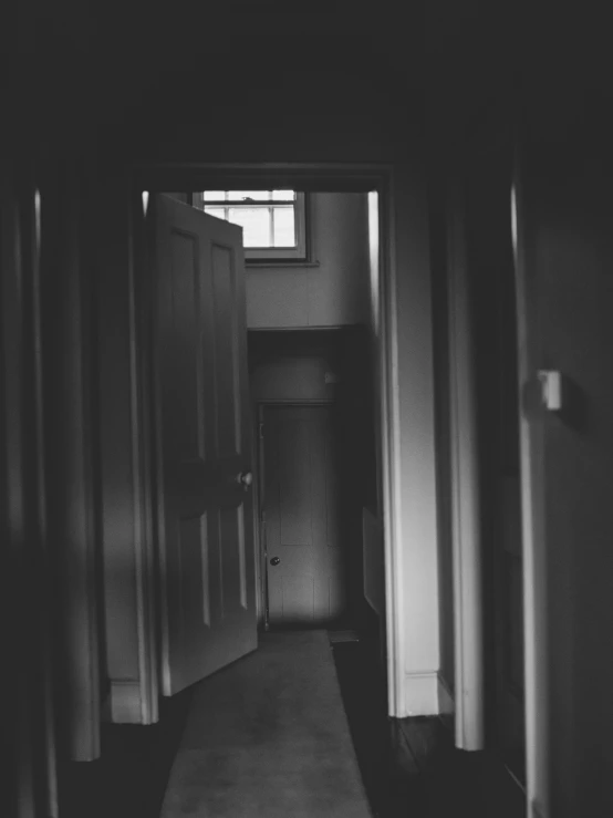 a black and white po of an empty hallway