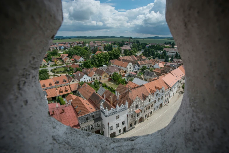 an aerial view from a tower with red roofs