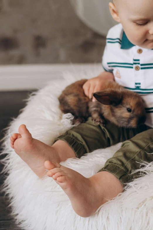 a baby sits on top of a fluffy bed