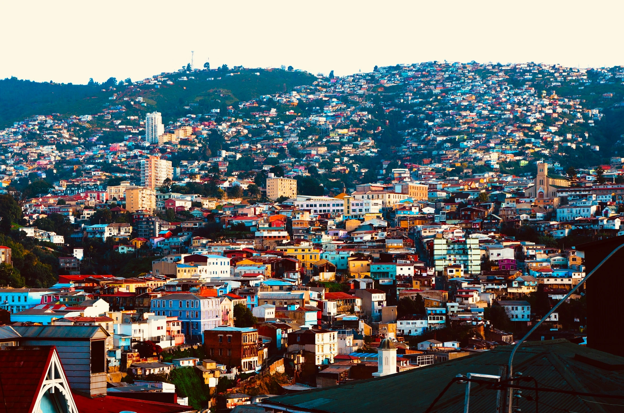 a bird's eye view of the city and a mountain