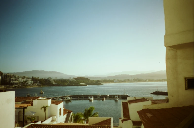 an aerial view of a bay and mountains