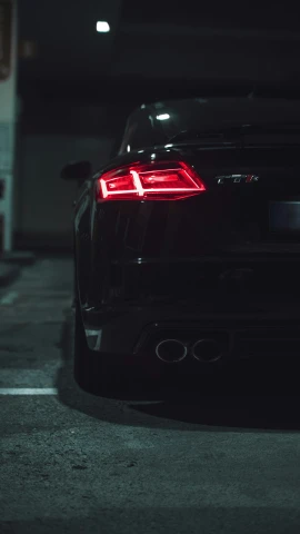 the tail light of a car at night